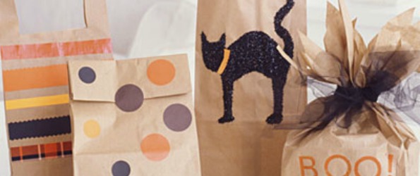 How can you decorate paper bags for Halloween?