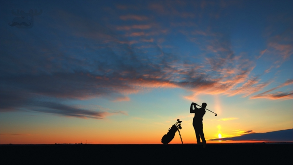 man golf player hit ball to air during sunset silhouetted